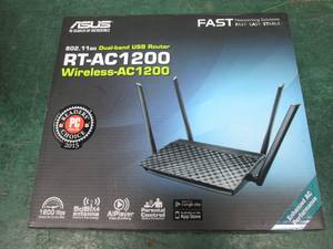 lot 63 image: Asus RT-AC1200 Wireless dual band USB router