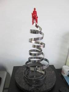 lot 131 image: Super Loving the Spin titanium artwork with lazy Susan style granite base made by Key West artist