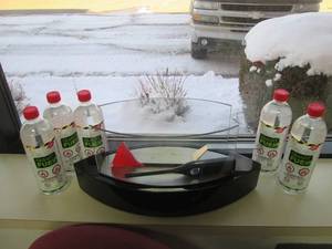 lot 135 image: Anytime fireplace with lighter and bottles of smart fuel