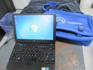 lot 180 image: Dell notebooklaptop with messenger style carrying bag and charger