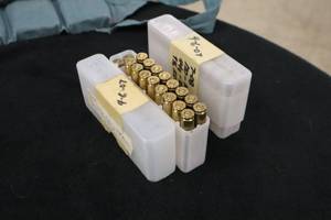 lot 123 image: Lot of (36) 7.08mm Rounds - (2) Plastic Ammo Containers