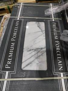lot 152 image: MSI Raphael Gray 16 in. x 32in. Polished Porcelain Stone Look Floor and Wall Tile (284 sq. ft.)