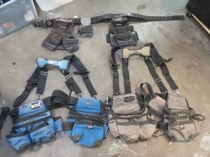 lot 18 image: 3 tool belts, two are bucketboss extreme gear with shoulder straps, one is a voyager heavy duty
