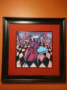 lot 19 image: Framed artwork by Daniel NG Cello and Chair.
