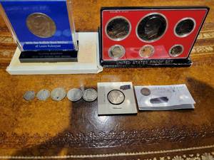 lot 50 image: A group of miscellaneous American Silver and other coins.