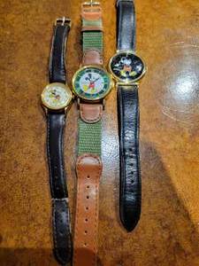 lot 52 image: A group of 3 Vintage Mickey Mouse Watches. 2 Pulsar. Lorus.