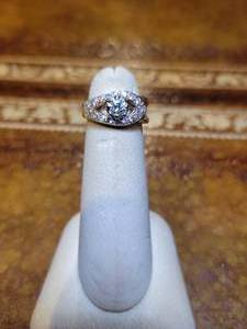 lot 61 image: 14k Yellow Gold  Diamond Ring. 12 carat Center Diamond  14 pave diamonds.