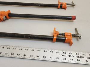 lot 12 image: (4) 48 Long Woodworking Pipe Clamps