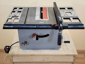 lot 10 image: Portable 10 Table Saw mounted on a Rolling Cabinet