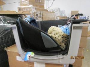 large dog kennel with other dog items in it