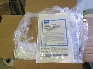 box of 100 packs of utility drapes...