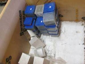 20 containers of deck screws in wooden crate