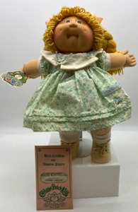 lot 39 image: Golden Double Braid Poodle Bangs Sherri Ariana CABBAGE PATCH in Green Floral Dress