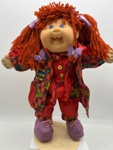 lot 81 image: Vintage Mattels First Edition Redhead Kinky Haired CABBAGE PATCH Girl w a Toothy Smile & Designer Line Clothing