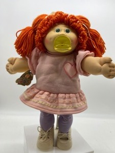 lot 152 image: Vintage Coleco Red Head Poodle Bangs & Pony Tail Paci Girl in Heart Dress