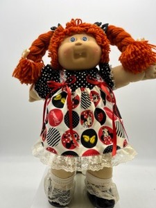 lot 157 image: Vintage Poodle Bangs Orange Red Head One Tooth Blue Eyed Pudgy Faced Girl Doll