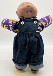 lot 163 image: Vintage Preemie CABBAGE PATCH Baldy Boy Doll Brown Eyes in a Minnesota Vikings Shirt & Denim Overalls HM#2