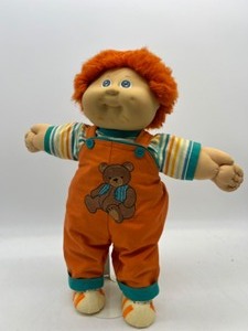 lot 25 image: Vintage CABBAGE PATCH Orange Fuzzy Boy in orange Teddybear overalls