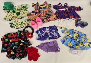 lot 230 image: 6 Themed Outfits St. Pattys, Tinkerbell, Pumpkin, Minions, Marvel, Monsters