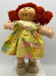 lot 190 image: 25th Anniversary CABBAGE PATCH Red Head Ponytails Green Eyes in a Cupcake Print Dress Play Along