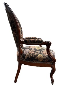 Louis XV Style Round-Back Walnut Armchair with Fine Carvings in the French Country Tradition