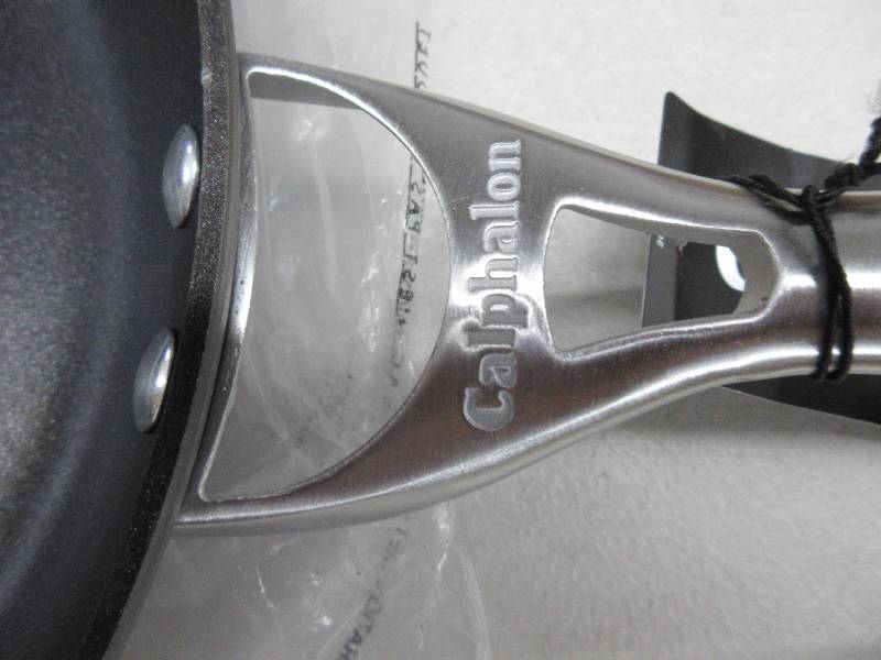 lot 113 image: Calphalon Contemporary Hard-Anodized Aluminum Nonstick Cookware, Omelette Pan, 12-Inch, Black. New, Slight Scratches (See Photo).