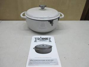 lot 219 image: Lodge 4.5 Quart Enameled Cast Iron Dutch Oven with Lid  Dual Handles  Oven Safe up to 500° F or on Stovetop - Use to Marinate, Cook, Bake, Refrigerate and Serve  Oyster White DAMAGED (PAINT IS CHIPPED)