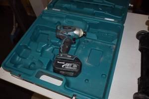 lot 602 image: Makita 14 18V Impact Driver with Charger, Case