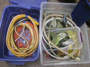 Covered totes with misc extension cords with replacement repair ends, ratchet straps bungee cords and other supplies