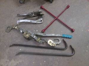 Assortment of pry bars, puller and pow-r-pull come along winch