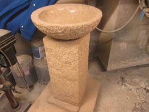 Heavy duty stone pedestal sink on rolling platform