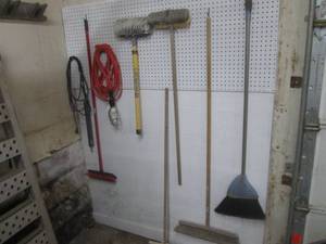 LED shop light with assorted cleaning brushes and brooms