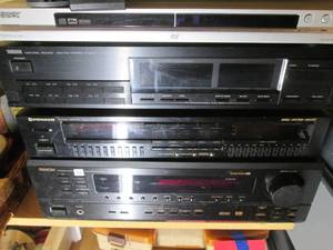 Stack of stereo components from Yamaha, Sony, Pioneer and Denon