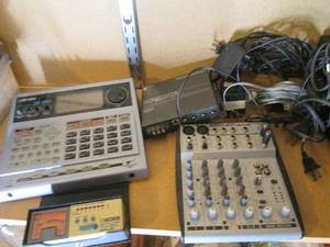 Hardside organizer basket containing a Boss Dr. Rhythm DR-880 guitar modeler