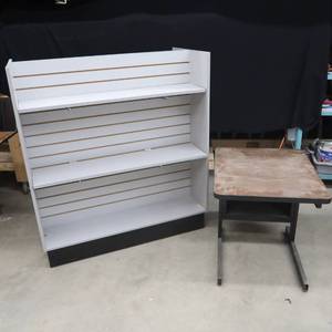 lot 126 image: A DESK AND A ROLLING DISPLAY SHELF