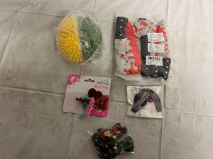 lot 150 image: Cat Self Massager, Bloody Knife Cat Nip Pouches, Cat Toys, and Cat Collars