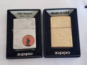 lot 27 image: Lot of 2 Zippos - 1935 Replica and Brass Florentine Design