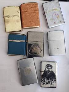lot 30 image: Lot of 7 Lighters - One is Duck Dynasty (Not Zippos)