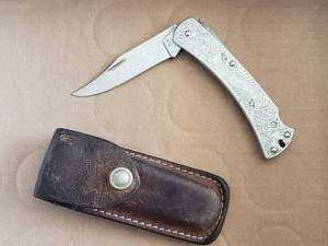lot 51 image: Vintage Buck 111 Lockback Knife with Sheath