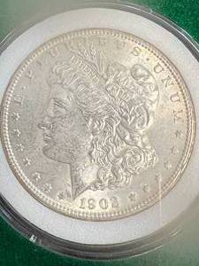 lot 03 image: 1902-O US MORGAN SILVER DOLLAR IN GREEN CASE
