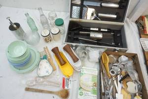 lot 25 image: New grill set, Melmac dish set, briquets, doughnut maker and lots of kitchen items
