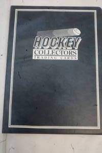 lot 154 image: Hockey Collections Book with Yu-Gi-Oh trading cards in it
