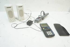 lot 412 image: Power Strip, speakers, Texas Instruments TI-83 Plus