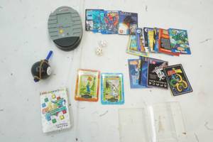 lot 457 image: Variety of Kid Trading Cards, Blurty Card Game, Plastic 8 ball, NFL Showdown (needs Batteries)
