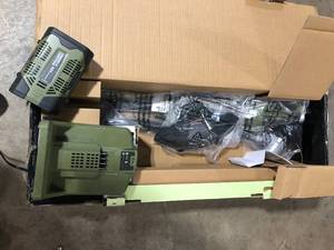 lot 16 image: Green Machine 62V 16 in. Cordless Carbon Fiber Shaft String Trimmer Brushless motor and Auto-Wind spool with 2.5AH Battery and Charger Customer Returns See Pictures