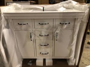 lot 1 image: Home Decorators Collection Bellington 42 in. W x 22 in. D x 34 in. H Bath Vanity in White with White Engineered Stone Top Customer Returns See Pictures