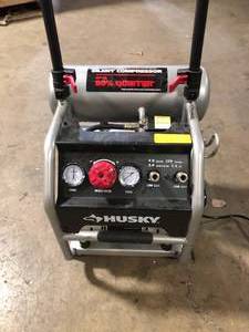 lot 32 image: Husky 4.5 Gal. Portable Electric-Powered Silent Air Compressor   Customer Returns See Pictures