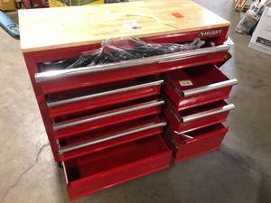 lot 38 image: Husky 42 in. W x 18.1 in. D 8-Drawer Red Mobile Workbench Cabinet with Solid Wood Top Customer Returns See Pictures