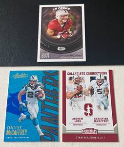 lot 107A image: Christian McCaffrey 3 Card Lot w Rookies - 2017 Contenders raft Picks #9, Sage HIT Premier Draft In Focus #127, and 2018 Absolute #14 Football Cards