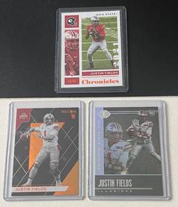 lot 114A image: Justin Fields 3 RC Lot - 2021 Chronicles Illusions, Chronicles Draft Picks, and Chronicles Recon Rookie Football Cards